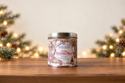 Clyde Candles A Little Christmas Magic Fireside candle in a festive illustrated tin with a silver lid