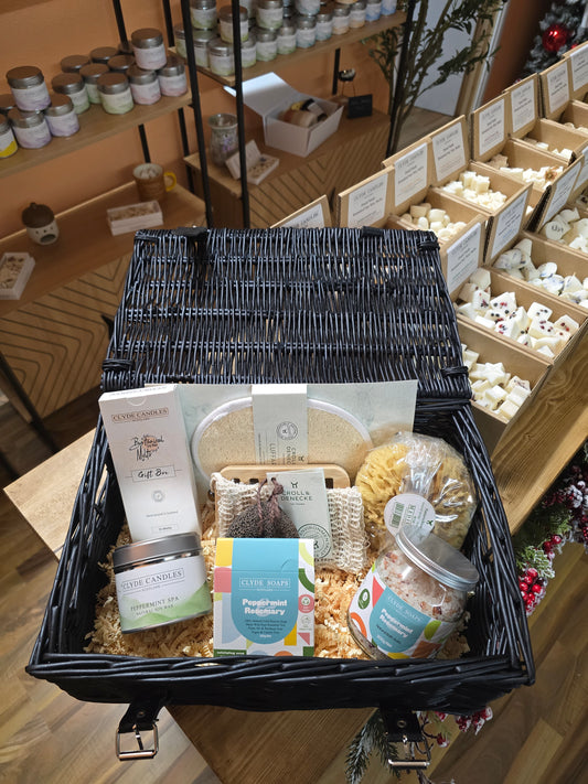 Full eco spa wood gift set laid out with natural bath items