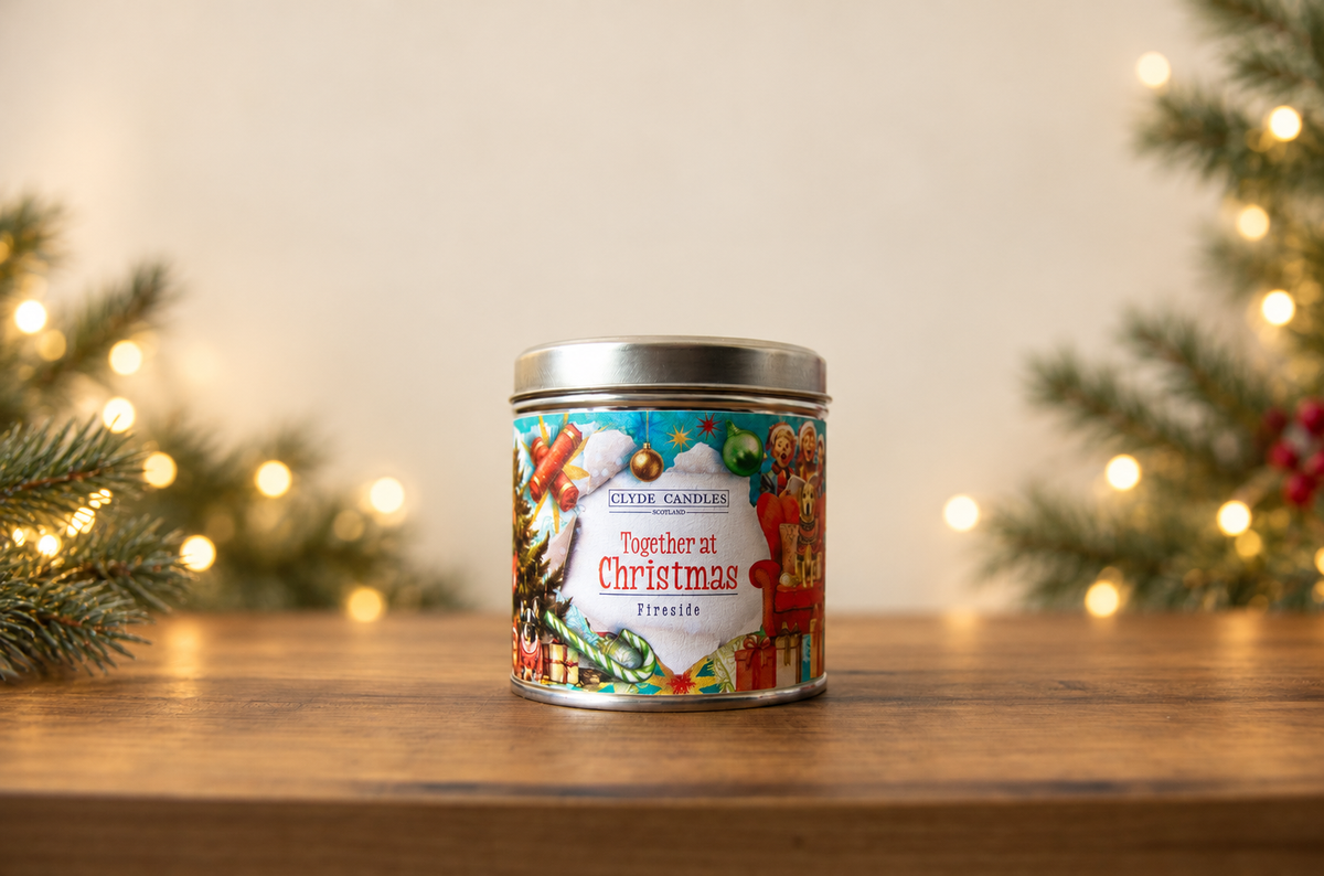 Clyde Candles Together at Christmas Fireside candle in a festive illustrated tin with a silver lid